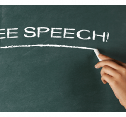 Free speech written on green chalkboard