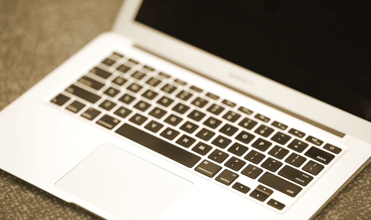 Silver laptop on desk
